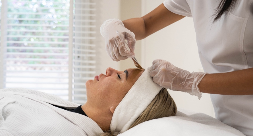 A patient receiving a professional skincare treatment to address skin pigmentation concerns. 