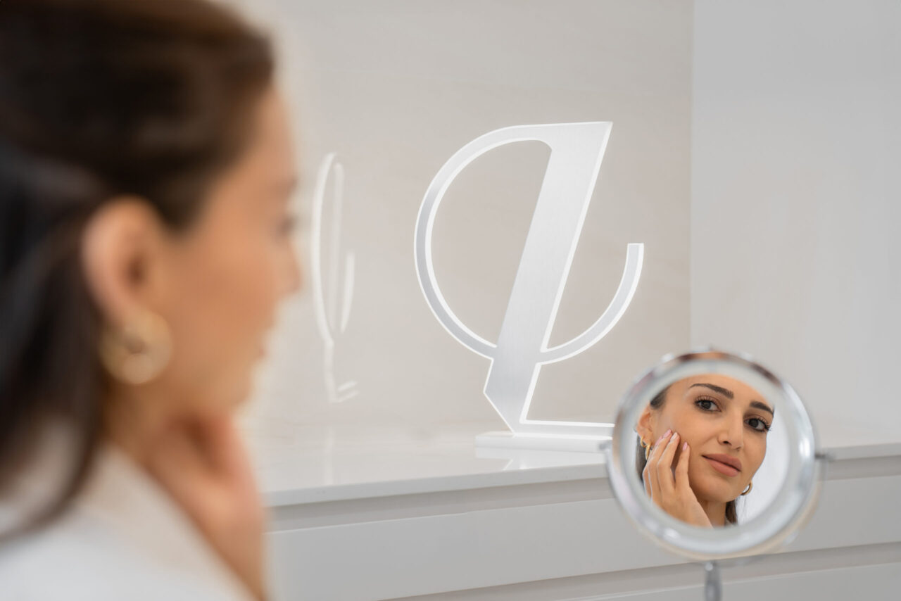 A woman looking at the mirror