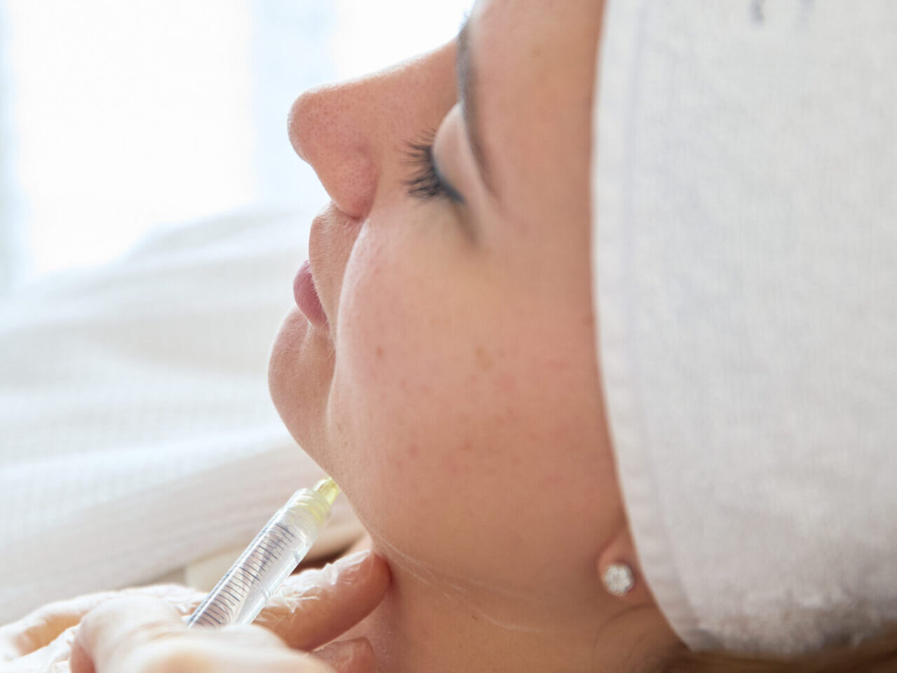 A woman getting a PB Serum treatment for body