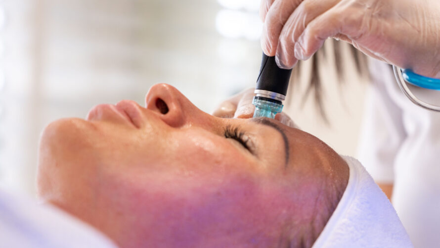 A woman getting Hydrafacial treatment