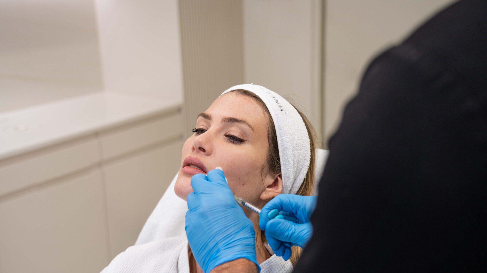 A woman getting a skin booster treatment