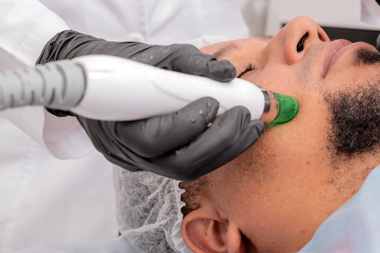 A man getting a men facial Dubai