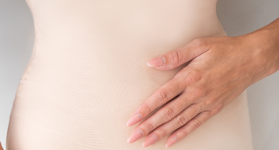 Close-up of a woman's hip, highlighting areas typically targeted by liposuction procedures.