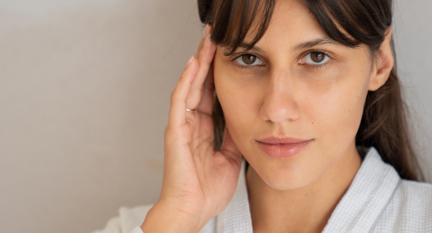 A young woman considering plastic surgery options to enhance her natural beauty.