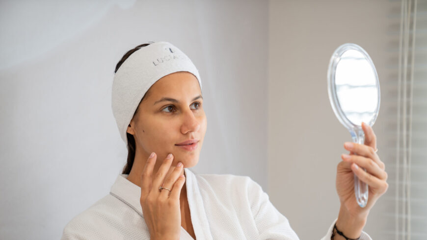 A woman looking at the mirror