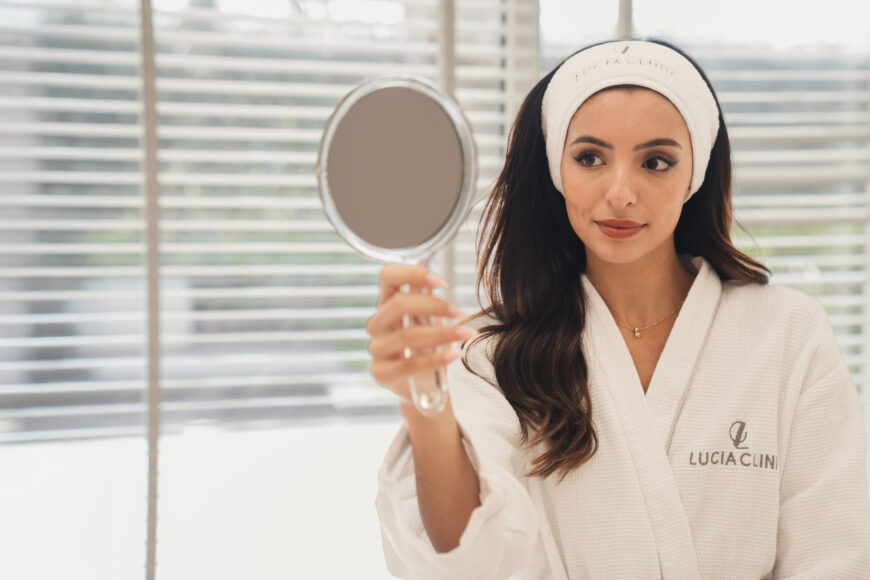 A woman looking at the mirror