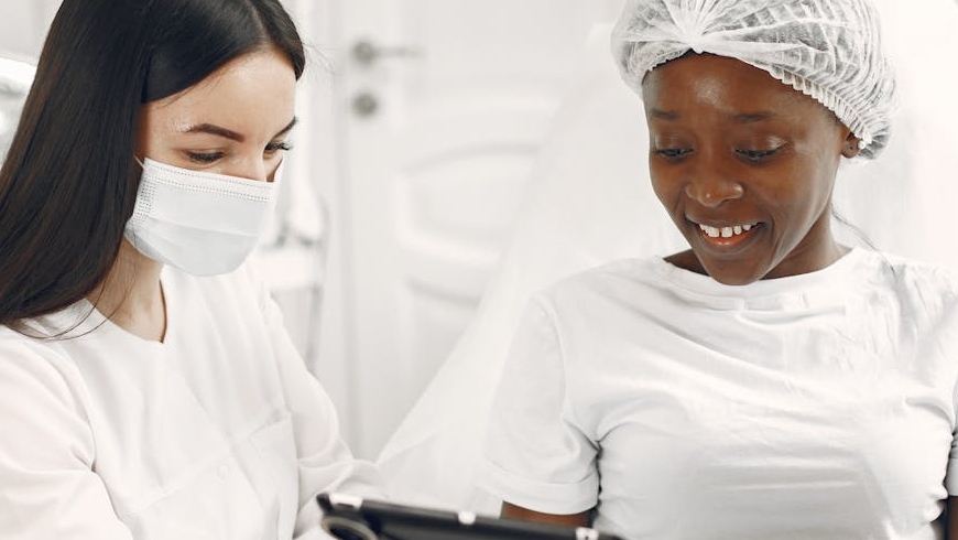 A dermatologist consults with a patient to discuss and choose the right keratosis pilaris treatment for smoother skin, based on their personal preferences.