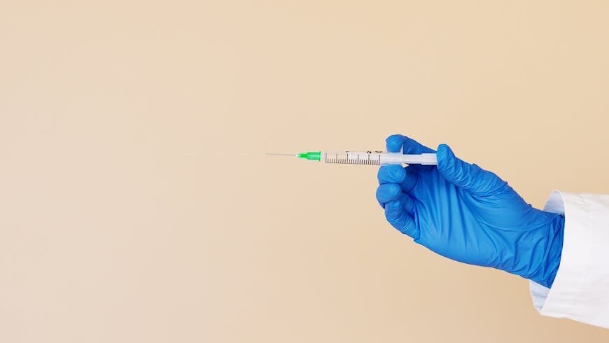 A nurse holding a syringe