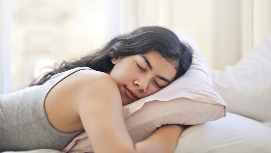 A woman lying on bed