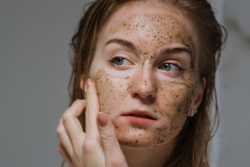 A woman putting serums