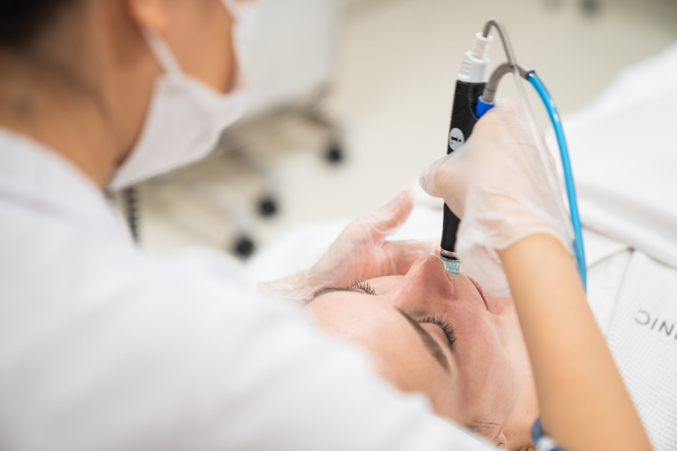 A patient getting professional skincare treatment at Lucia Clinic