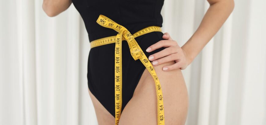 A Measuring Tape on a Woman's Waist