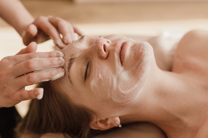 A woman getting facial at Lucia Clinic