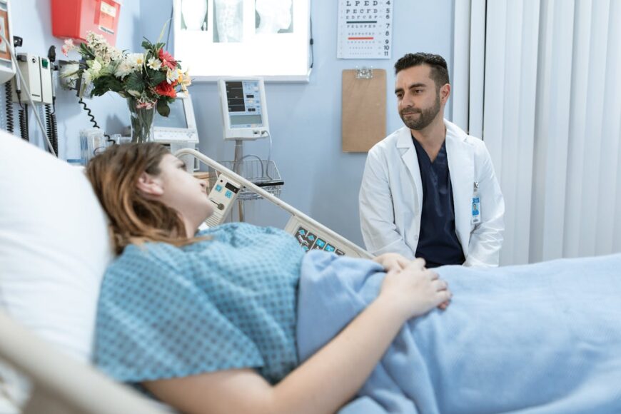 Doctor talking to a patient about what to expect after breast implant removal