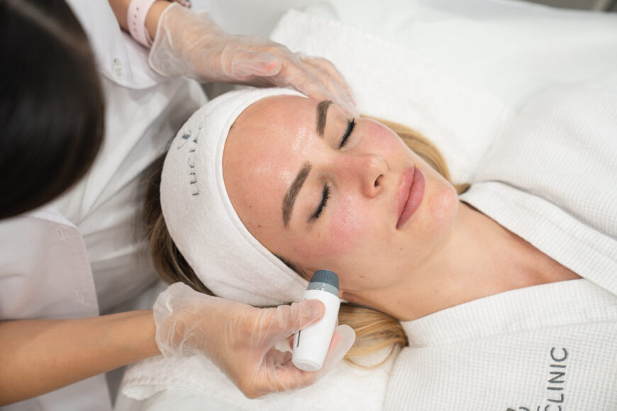 A woman getting a treatment at Lucia Clinic