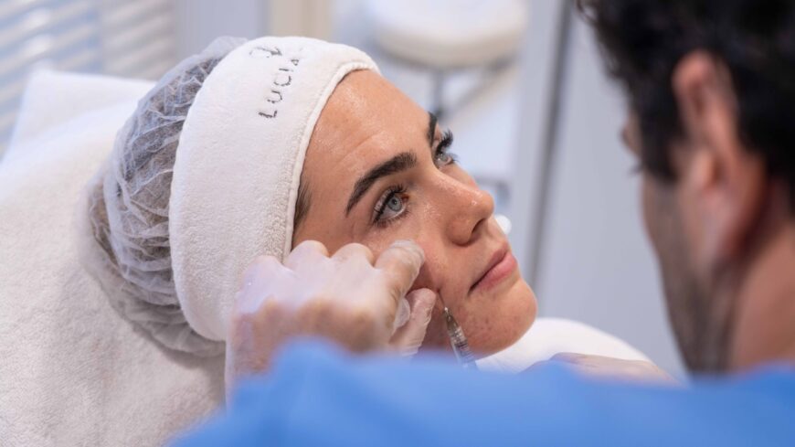 Woman getting cheek fillers after getting answers from Dubai's cheek fillers specialists