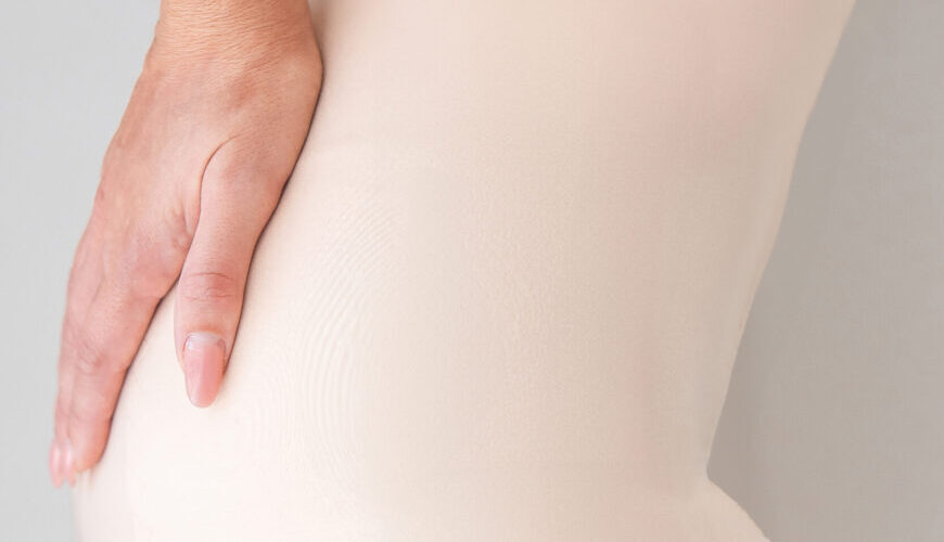 A woman after a mommy makeover