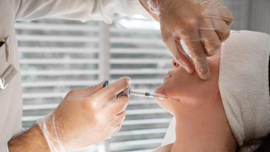 A woman getting a face injection