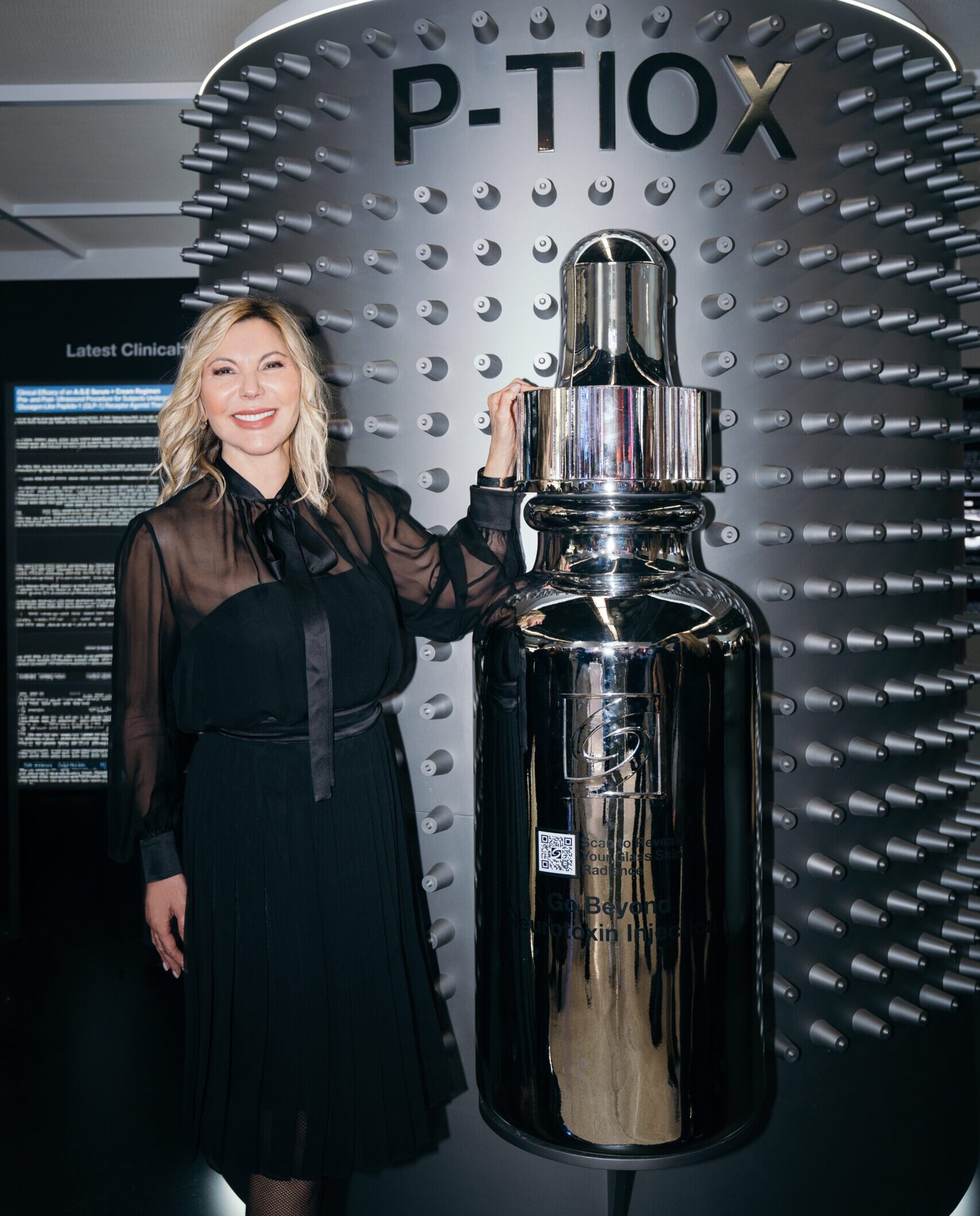 Dr. Radmila at the SkinCeuticals booth thinking about P-TIOX serum