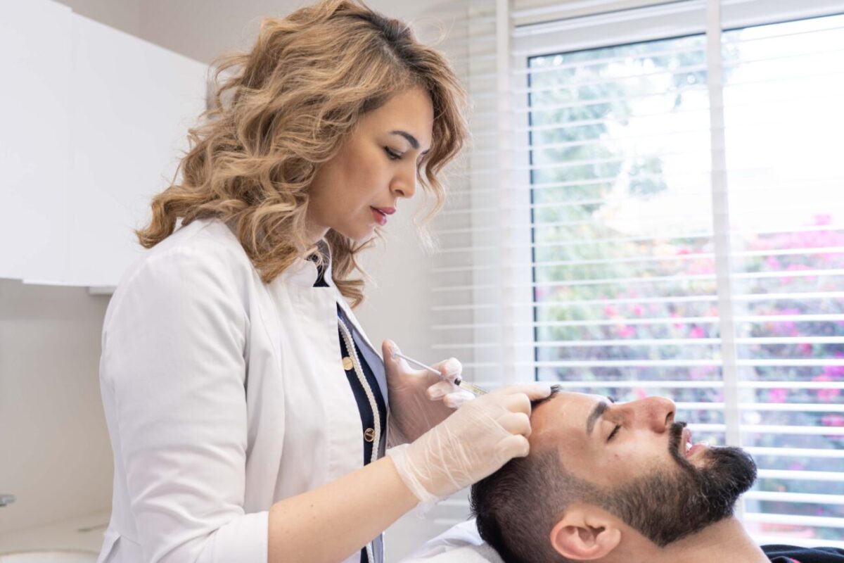 A man getting a hair loss treatment