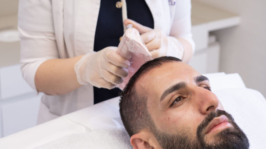 A man getting a hair loss treatment