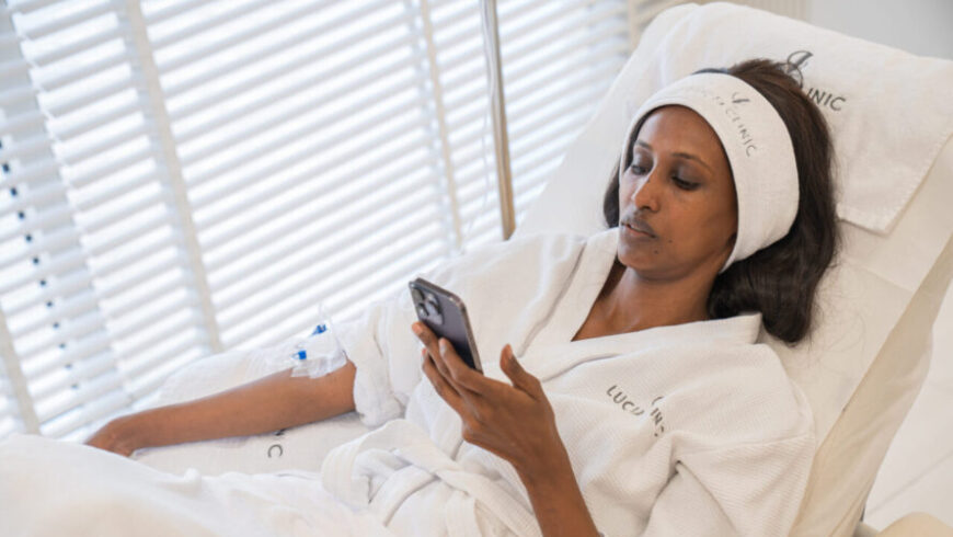 A woman taking IV drips therapy after surgery