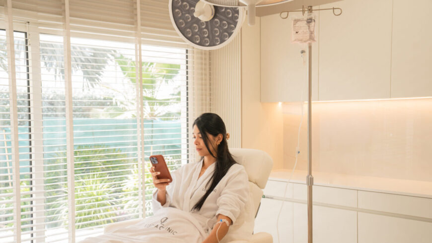 A woman looking at a phone before 3D imaging