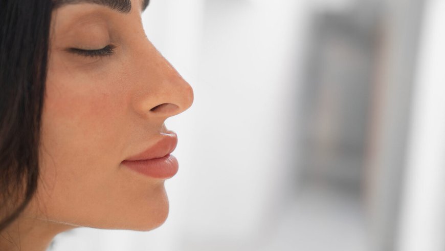 Side profile of a woman considering how many plastic surgery procedures can be combined